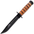 The combat-ready knife has a 7” stainless steel clip point blade with a heat-treated, black finish and it’s razor-sharp