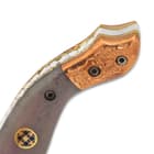 The most striking feature of the attractive pocket knife are the delicately engraved copper bolsters