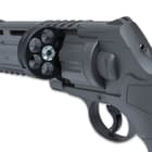 Powered by 12-gram CO2 cartridges (not included), the revolver will shoot both .50 caliber paintballs and rubber balls