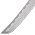 It has a hair-splitting sharp, 9 1/4” Damascus steel tanto blade, which extends from a brass habaki