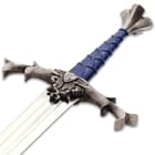 The 43” overall sword comes with a wooden scabbard that is also covered in blue leather and adorned with flower-like fittings
