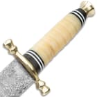 The carved handle is made from genuine bone and has a brass guard and pommel. 