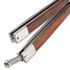 The genuine cocobolo wood handles of the butterfly knife secure with a stainless latch.
