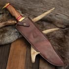 The 17” bowie can be stored and carried in its genuine, premium leather belt sheath, which has a snap strap closure