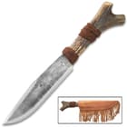 The 14” knife with rough forged blade and horn handle is shown alongside its brown leather sheath with leather tassels.
