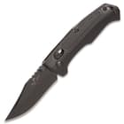 It has a 2 3/4”, 14C28N steel clip point blade that has been hollow ground and has a black, non-reflective finish