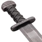 The replica  sword has a sharpened, 30 5/8” 1065 high carbon steel blade and features a snub-hilt with a distinct lobed-pommel