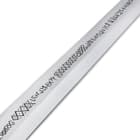 Close view of Legends of Steel sword with viking symbols etched on the blade
