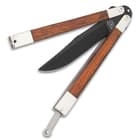 The 5” high carbon stainless steel hollow ground blade with titanium black finish flips into genuine cocobolo wood handles.