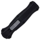 The black handle is constructed of 6061-T6 aluminum and it has a deep-carry, tip-down MOLLE compatible pocket clip