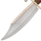 The bowie has a 10 1/2” stainless steel, clip point blade with a brass spine, extending from a polished brass handguard