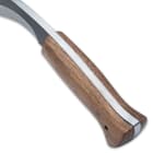 The handle scales are natural-finished hardwood, secured to the tang with brass pins, and there is a brass tube lanyard hole