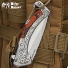ridge runner doc holiday pocket knife hanging on backpack with carabiner
