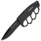 The knife has a 3 3/4” stainless steel blade with a black, non-reflective finish and it features the Marine logo laser-etched in white