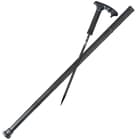 Black sword cane detached from its fiberglass casing showing the sharp stainless blade and piercing tip
