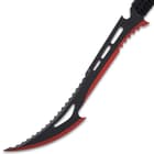 It has a razor-sharp, 17" upswept and pointed blade with a two-toned, black and red finish and a heavily notched spine