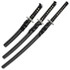 Three swords shown side-by-side inside black scabbards with black hanging cord and black cord wrapped handles. 