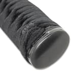 Close shot of black cord-wrap handle and bookended black metal pommel
