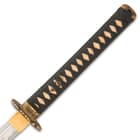 The handle is wrapped in genuine ray skin and black cord-wrap and the handguard and pommel are solid brass with black accents