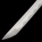 The full-tang, 28 1/2” blade is crafted of high carbon steel, which extends from a polished brass habaki