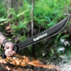 A hand is shown holding the machete by its textures TPU handle with the “Swamp Master” logo on the black in full view.