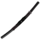 The grip is leather-wrapped, and the pommel is cast steel.