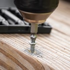 Plug the Screw Extractor into your drill to extract a stripped screw.