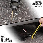 Full image showing the Scissor Jack Ratchet Wrench in use.