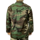 The woodland camo shirt has a tough, 65-percent polyester and 35-percent cotton rip-stop construction that’s comfortable for all-day wear