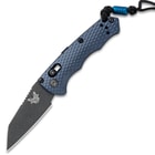 The Benchmade Immunity Automatic Knife has a charcoal grey, anodized 6061-T6 billet aluminum handle with lock mechanism on the side.