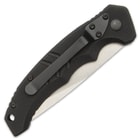 The knife’s G10 handle has a fluted thumb rest and tip down pocket clip.