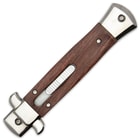 Closed wood handled stiletto pocket knife with mirror polished accents and a slide trigger opening. 

