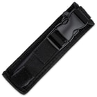 Large OTF automatic knife enclosed in a black nylon sheath with a buckle closure. 

