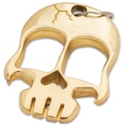 The Skull Head Brass Paperweight is solid brass.