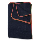 The blanket is made out of 50 percent wool, weighing approximately 2 lbs, and it has orange stitching around the edges