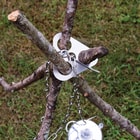 It has a triangle stainless steel construction with holes for the branches