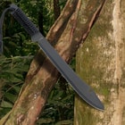 The 20” machete is one solid piece of black coated stainless steel shown in front of a forest background.