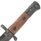 The authentic replica has a 12” high carbon iron blade and muzzle ring with wooden handle scales, secured with screws
