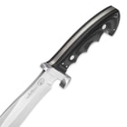 Detailed view of the knife’s black Micarta handle and stainless steel guard.