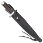 The knife housed in a black genuine leather sheath with a strap.