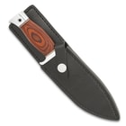 The 8 3/4” overall knife can be carried securely in its premium leather sheath with a heavy-duty steel belt clip
