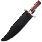 Large bowie knife enclosed in a black leather sheath with an exposed gold handguard and wood handle. 
