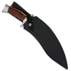 The 17 3/8” overall kukri knife slides smoothly into a genuine leather, basket-woven belt sheath with a snap strap closure