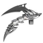 The claw shaped finger cover has a 2 1/4" blade in the shape of a talon. 
