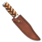 The knife can be secured into its included premium leather belt sheath with embossed decorations.