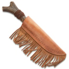 The 14” knife can be kept in its brown leather belt sheath with leather tassels.