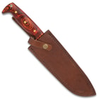 The bowie knife secured in its sheath