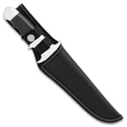 The fixed blade knife in its belt sheath
