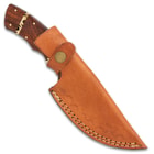 The knife in its leather sheath