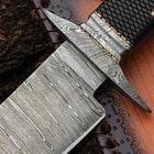 A close-up of the bowie knife's handguard